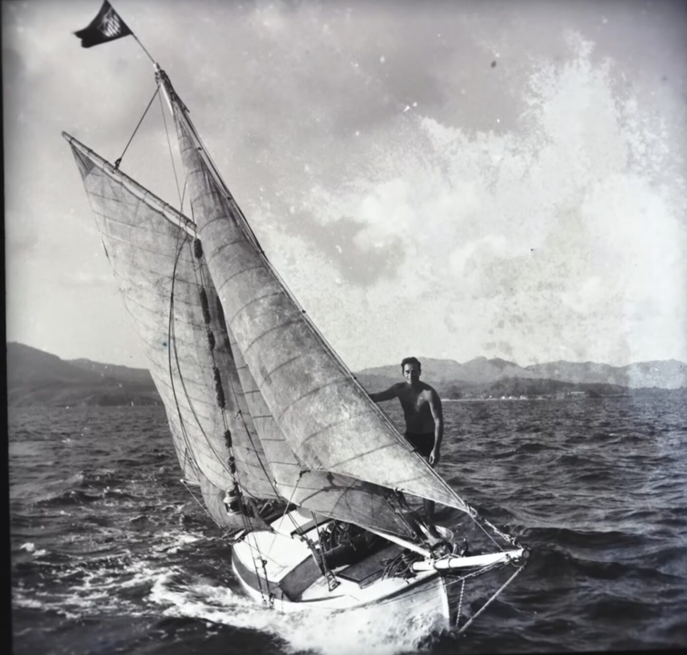 Young Paul Johnson sailing a small boat