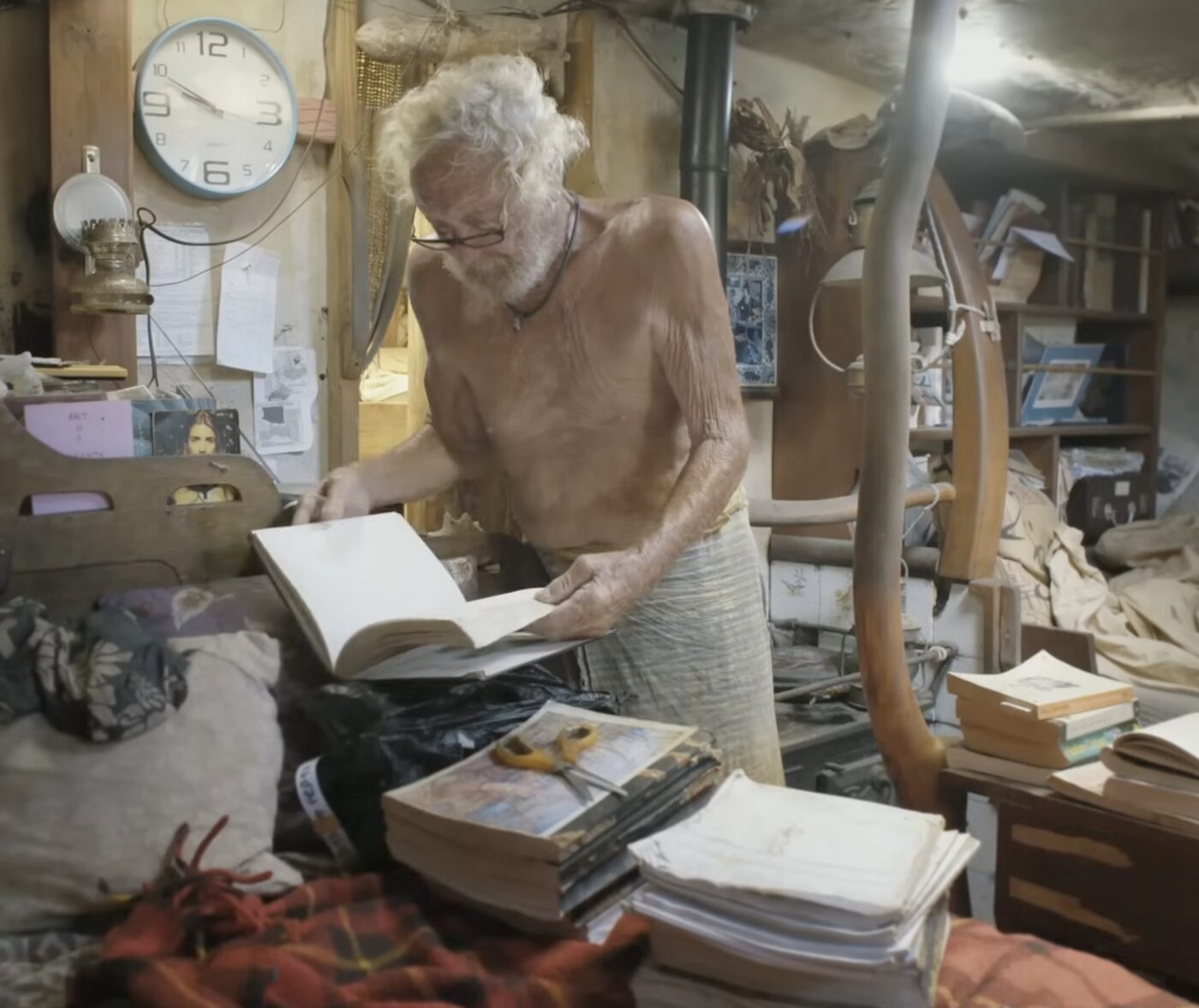 Paul Johnson reading below deck aboard Cherub