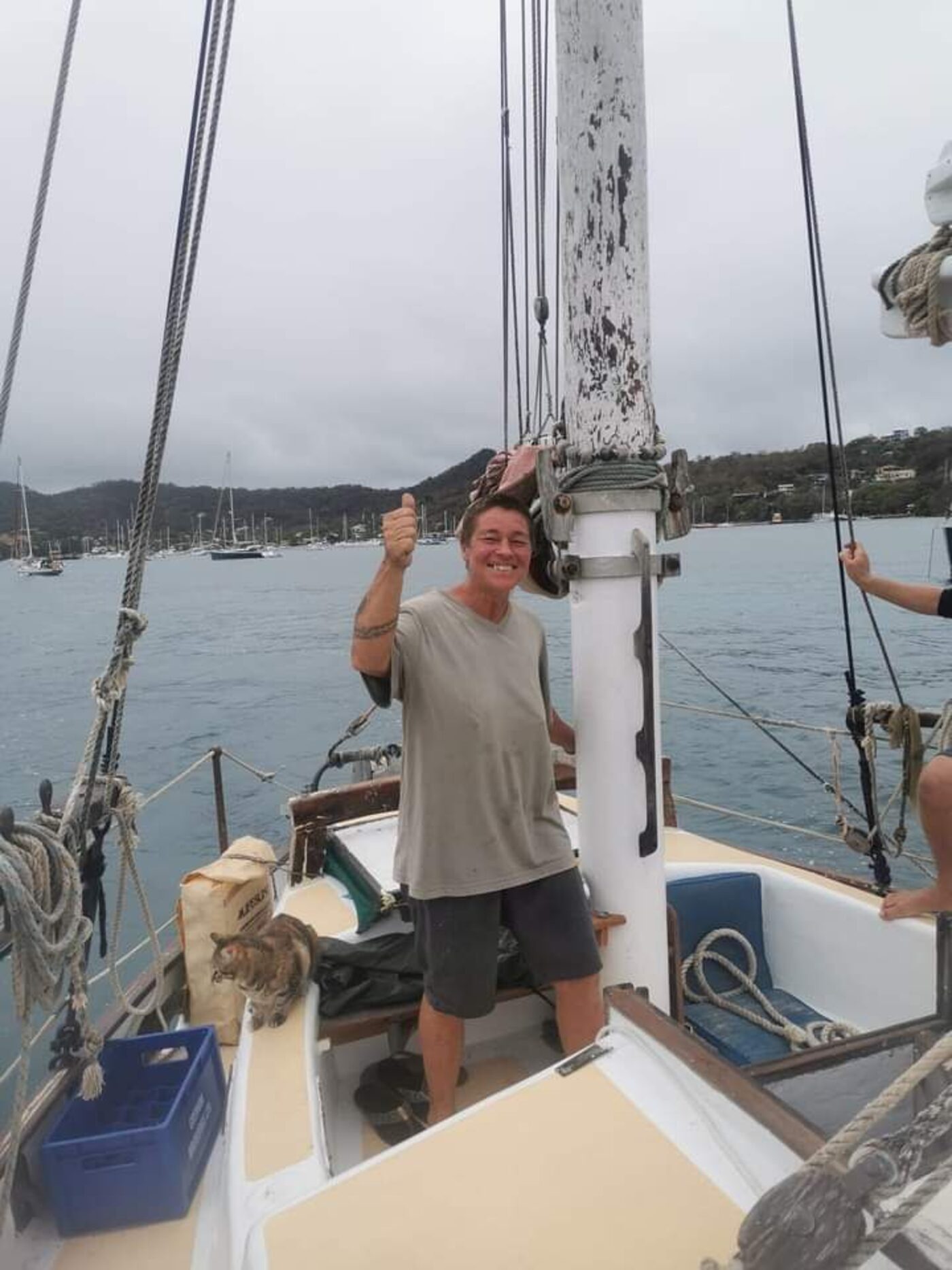 Angie aboard Cherub giving thumbs up after refit work